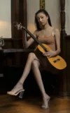 MA_SCARLETT_BLOOM_GUITAR_HERO_2.webp